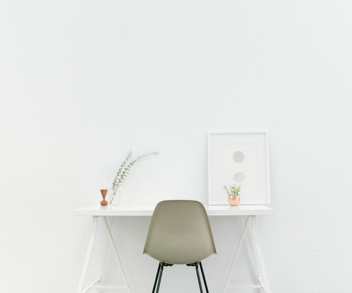 Desk and chair in a bright room, pick a plan